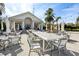 Elegant clubhouse patio with modern outdoor seating and a relaxing ambiance under string lights at 4857 Tobermory Way, Bradenton, FL 34211