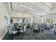 Bright dining room featuring elegant decor, stylish seating, and large windows with a view at 4857 Tobermory Way, Bradenton, FL 34211