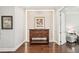 Elegant entryway featuring hardwood floors, detailed wood furniture, and custom wall art at 4857 Tobermory Way, Bradenton, FL 34211