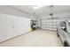 Clean and organized garage with ample storage cabinets and space for vehicles at 4857 Tobermory Way, Bradenton, FL 34211