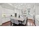 A large kitchen with a granite island, stainless appliances, and ample storage space at 4857 Tobermory Way, Bradenton, FL 34211