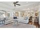 Spacious living room boasting coffered ceilings, hardwood floors, and an open floor plan at 4857 Tobermory Way, Bradenton, FL 34211