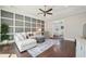 Cozy living room featuring modern decor and a view into the bedroom at 4857 Tobermory Way, Bradenton, FL 34211