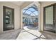 Inviting screened-in patio with tiled floor and comfortable seating area and fireplace at 4857 Tobermory Way, Bradenton, FL 34211