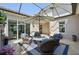 Outdoor patio features an umbrella, wicker furniture, and access to the yard at 4857 Tobermory Way, Bradenton, FL 34211