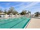 A stunning community pool with lounge chairs and pristine water at 4857 Tobermory Way, Bradenton, FL 34211
