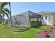 A screened patio extends from the home, providing an outdoor living area for relaxing and entertaining at 4857 Tobermory Way, Bradenton, FL 34211