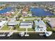 Aerial view of waterfront homes with direct access to the canal, providing scenic views and boating opportunities at 5321 Bowline Bnd, New Port Richey, FL 34652