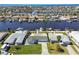 Real estate featuring waterfront property with boat docks along canal and neighborhood homes in the background at 5321 Bowline Bnd, New Port Richey, FL 34652