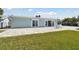 Backyard featuring large paver patio and well manicured lawn at 5321 Bowline Bnd, New Port Richey, FL 34652