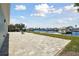 Backyard patio overlooking the water and boat docks, perfect for relaxing and enjoying the view at 5321 Bowline Bnd, New Port Richey, FL 34652