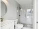 Bathroom featuring glass-enclosed shower with decorative tile and white vanity at 5321 Bowline Bnd, New Port Richey, FL 34652