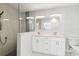 Bathroom featuring a double vanity, shower, and contemporary finishes at 5321 Bowline Bnd, New Port Richey, FL 34652