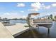 Features a boat lift for convenient waterfront access and boating enjoyment at 5321 Bowline Bnd, New Port Richey, FL 34652