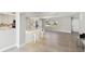 Modern kitchen with white cabinets, marble countertops, a large island, and an open floor plan at 5321 Bowline Bnd, New Port Richey, FL 34652