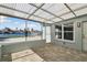 Enclosed lanai offering water views, pavers, and access to the indoors at 5321 Bowline Bnd, New Port Richey, FL 34652