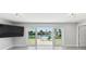 Spacious living room with waterfront views and sliding glass doors to a patio at 5321 Bowline Bnd, New Port Richey, FL 34652