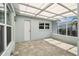 A cozy covered patio featuring tile floors and natural light at 5321 Bowline Bnd, New Port Richey, FL 34652