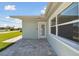 Paved patio with a well-maintained exterior and access to the home's entrance at 5321 Bowline Bnd, New Port Richey, FL 34652