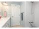 Bright bathroom featuring a tub and shower combination, white vanity, and neutral decor for a clean and functional space at 553 E Lake Dr, Largo, FL 33771