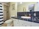 Stylish bathroom with a tiled countertop, modern fixtures, and shower/tub combination for a comfortable experience at 553 E Lake Dr, Largo, FL 33771