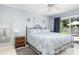 Inviting bedroom featuring a decorative wrought iron bed frame and a neutral color palette at 553 E Lake Dr, Largo, FL 33771