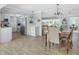 Bright dining area with natural light, a wooden table set, and tile floors at 553 E Lake Dr, Largo, FL 33771