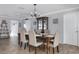 Well-lit dining room features a dark wood table with seating for six and a built-in display cabinet at 553 E Lake Dr, Largo, FL 33771