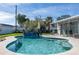 Inviting swimming pool with clear blue water, surrounded by lush greenery and a patio area for leisure at 553 E Lake Dr, Largo, FL 33771