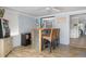 Poolside bar with wooden counter, wicker stools, and a view to the kitchen and pool at 553 E Lake Dr, Largo, FL 33771