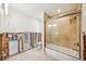 Bathroom featuring a bathtub, shower, toilet, and fixtures. There is an open doorway to an adjacent room at 5815 Bali S Way, St Pete Beach, FL 33706