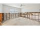 Bedroom with a ceiling fan and natural light, awaits restoration to its full potential at 5815 Bali S Way, St Pete Beach, FL 33706