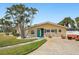 Charming single-story home with a well-manicured lawn and unique stone accents at 5815 Bali S Way, St Pete Beach, FL 33706