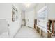 Hallway with white walls, shelving, front door, window, and tile flooring during renovation at 5815 Bali S Way, St Pete Beach, FL 33706
