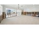 Spacious living room with a fireplace and open floor plan, ready for renovation at 5815 Bali S Way, St Pete Beach, FL 33706