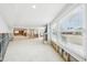 Bright living space with a brick fireplace and views into the kitchen at 5815 Bali S Way, St Pete Beach, FL 33706