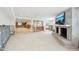 Large living room with an open layout, fireplace, and ample natural light at 5815 Bali S Way, St Pete Beach, FL 33706
