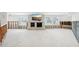 Bright living room with a large window and brick fireplace at 5815 Bali S Way, St Pete Beach, FL 33706