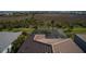 An aerial view of the back of the house, showing the screened in lanai and landscaping at 6104 Talon Preserve Dr, Nokomis, FL 34275