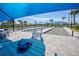 Community bocce ball court with shade structures and tables for comfortable viewing at 6104 Talon Preserve Dr, Nokomis, FL 34275