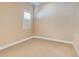 Cozy empty room with neutral paint and carpeting, offering a blank canvas for personalization and design at 6104 Talon Preserve Dr, Nokomis, FL 34275