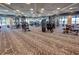Community gym with high ceilings, modern exercise machines, and ample natural light at 6104 Talon Preserve Dr, Nokomis, FL 34275