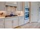 Modern kitchen showcasing stainless steel appliances, stylish cabinetry, and updated countertops at 6104 Talon Preserve Dr, Nokomis, FL 34275