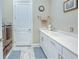 Well-equipped laundry room with a large utility sink, white cabinets, and modern washer/dryer at 6104 Talon Preserve Dr, Nokomis, FL 34275
