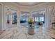 Wide view of the lobby with a large table and multiple seating areas in view at 6104 Talon Preserve Dr, Nokomis, FL 34275