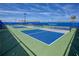 Community pickleball courts with green and blue surface, surrounded by well-maintained fencing at 6104 Talon Preserve Dr, Nokomis, FL 34275