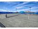 Well-maintained tennis courts with blue fencing and ample space for recreational play at 6104 Talon Preserve Dr, Nokomis, FL 34275