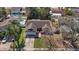 Aerial view of a landscaped home with a driveway and attached two-car garage in a residential neighborhood at 6908 Shady Pl, Tampa, FL 33634