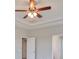 Second story view of bedroom with open doors and neutral paint at 7010 Old Benton Dr, Apollo Beach, FL 33572