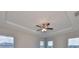 Second story view of bedroom with ceiling fan and natural light at 7010 Old Benton Dr, Apollo Beach, FL 33572